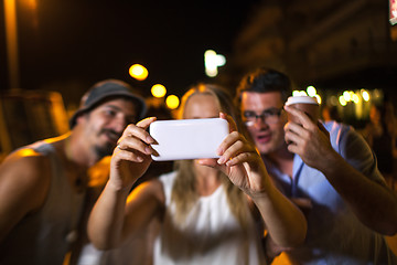 Image showing Friends selfie at night