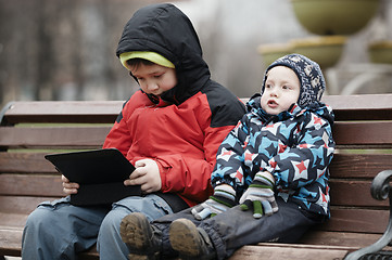 Image showing Brothers with tablet computer