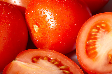 Image showing Fresh red tomatoes with water drops.