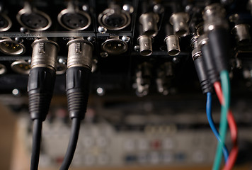 Image showing Rear panel of the professional recorder with cables.