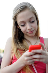 Image showing Young girl sending a message