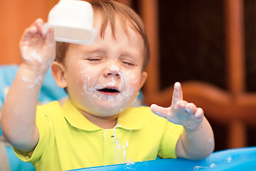 Image showing Little boy crying with face got dirty