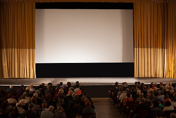 Image showing Audience in front of white cinema screen