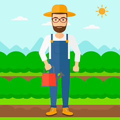 Image showing Farmer with watering can.