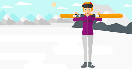 Image showing Woman holding skis.