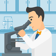 Image showing Laboratory assistant with microscope.