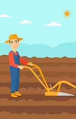 Image showing Farmer on the field with plough.