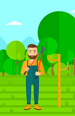 Image showing Farmer with pruner in garden.