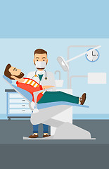 Image showing Dentist and man in dentist chair.