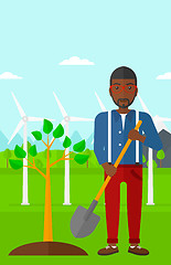 Image showing Man plants tree.