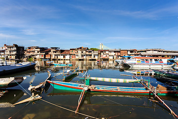 Image showing poor houses by the river in shantytown