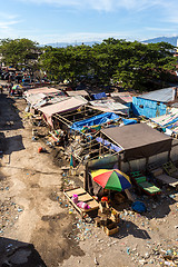 Image showing poor houses by the river in shantytown