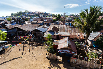 Image showing poor houses by the river in shantytown