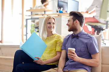 Image showing office workers with folder and coffee