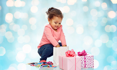 Image showing happy little baby girl with birthday presents