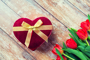 Image showing close up of red tulips and chocolate box