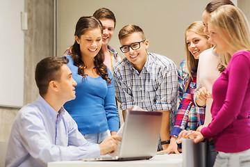 Image showing group of students and teacher with laptop