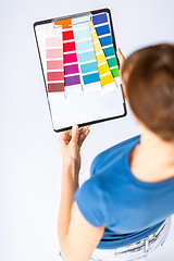 Image showing woman working with color samples for selection