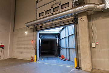 Image showing warehouse door or gate and truck container