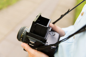 Image showing close up of male photographer with digital camera