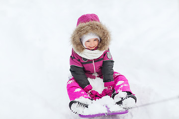 Image showing happy little kid on sled outdoors in winter