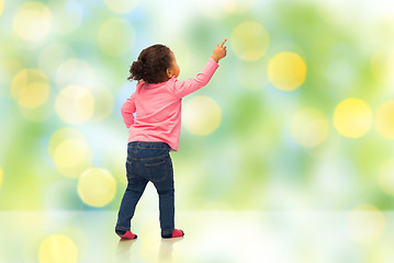 Image showing african baby girl pointing finger to something