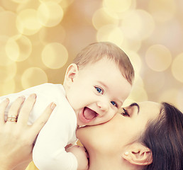 Image showing laughing baby playing with mother