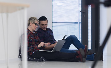 Image showing startup business, couple working on laptop computer at office