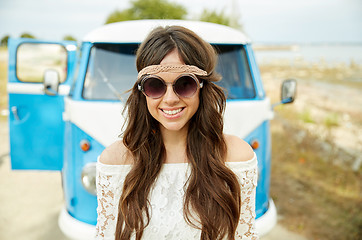 Image showing smiling young hippie woman in minivan car