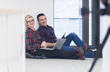 Image showing startup business, couple working on laptop computer at office