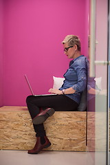 Image showing woman in crative box working on laptop