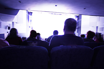 Image showing People watching at bright screen in cinema