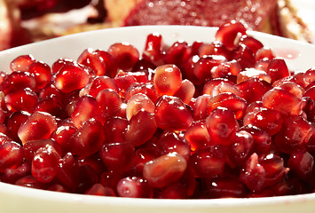 Image showing Pomegranate seeds in a white bowl.