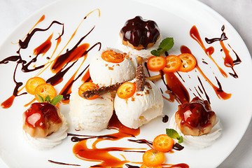 Image showing Ice cream with kumquat and meringue biscuits