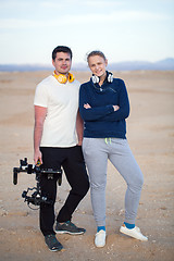 Image showing Young people with steadycam on the beach