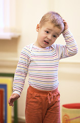 Image showing Cute little boy with a puzzled expression