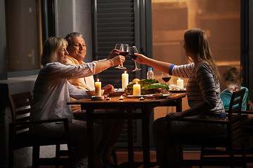 Image showing Quiet family dinner in the backyard