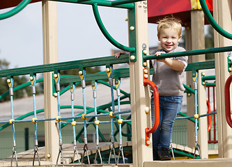 Image showing Boy on playground equipment.