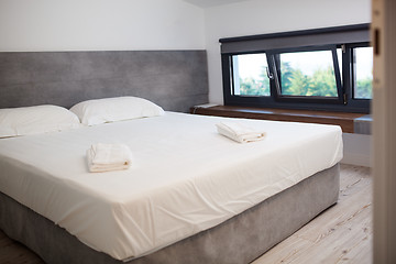 Image showing Empty hotel room with king-sized bed