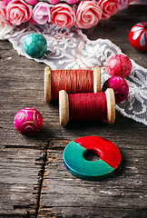 Image showing Beads and spool of thread