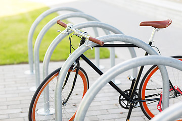 Image showing close up of fixed gear bicycle at street parking