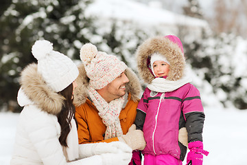 Image showing happy family with child in winter clothes outdoors