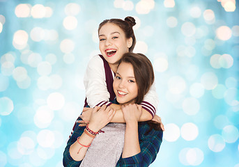 Image showing happy smiling pretty teenage girls hugging