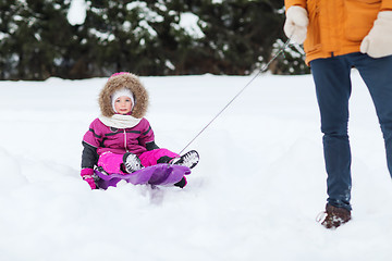 Image showing happy little kid on sled outdoors in winter