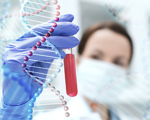 Image showing close up of scientist holding test tube in lab