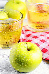 Image showing apple and glass of juice