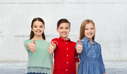 Image showing happy children showing thumbs up