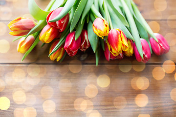 Image showing close up of tulip flowers on wooden table