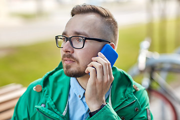 Image showing young hipster man calling on smartphone