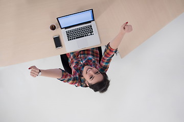 Image showing top view of young business woman working on laptop